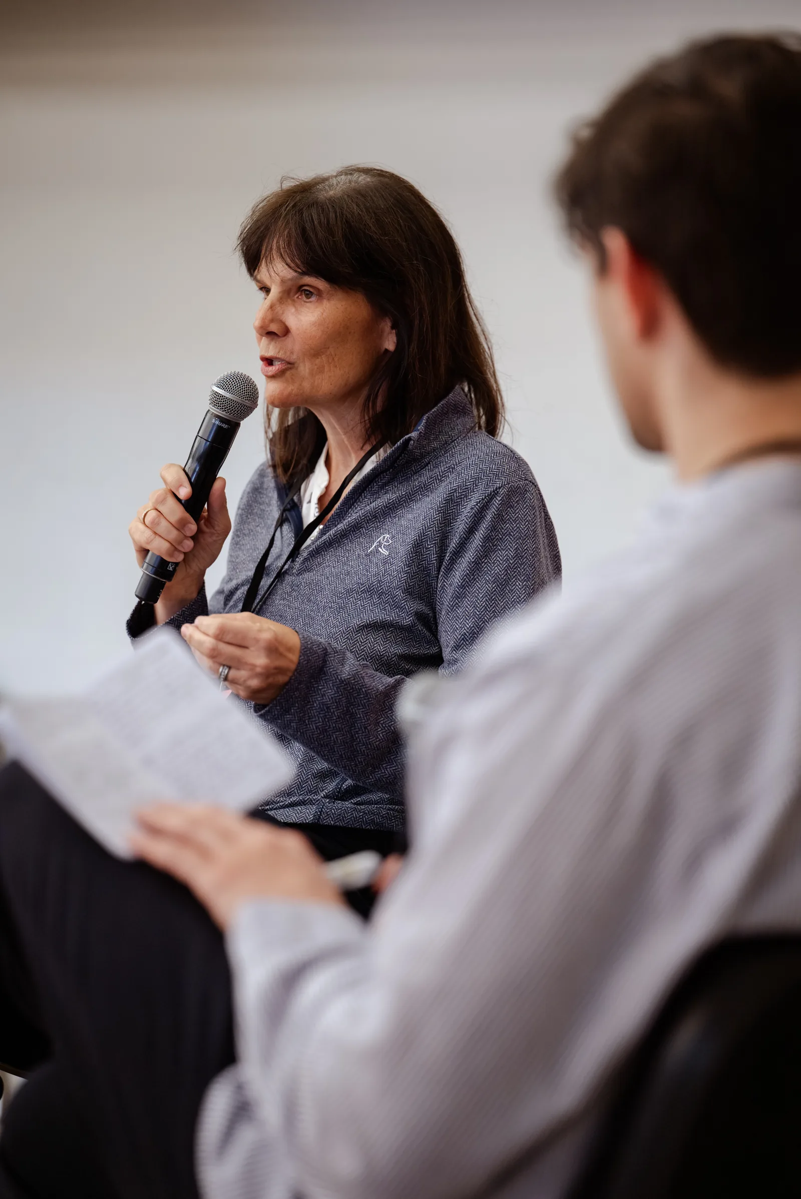 A participant speaking into a microphone