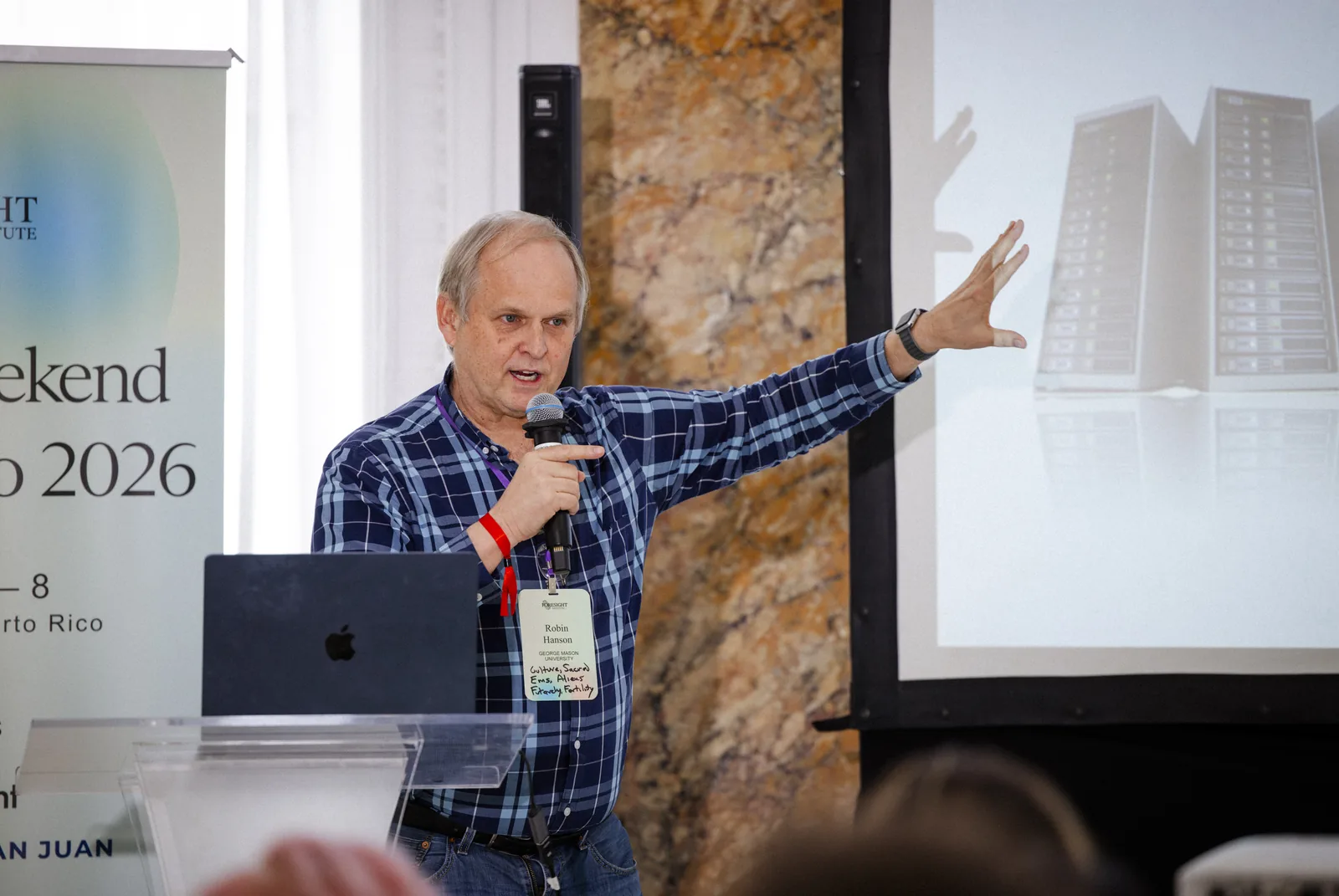 A speaker presenting at Vision Weekend 2026