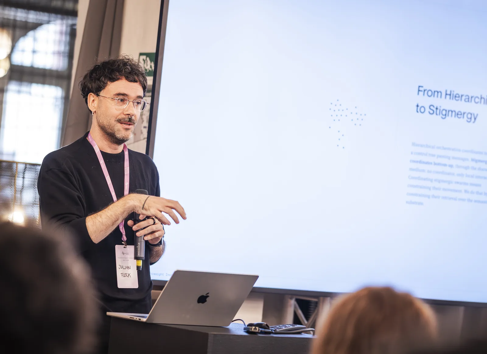 A speaker presenting at a workshop